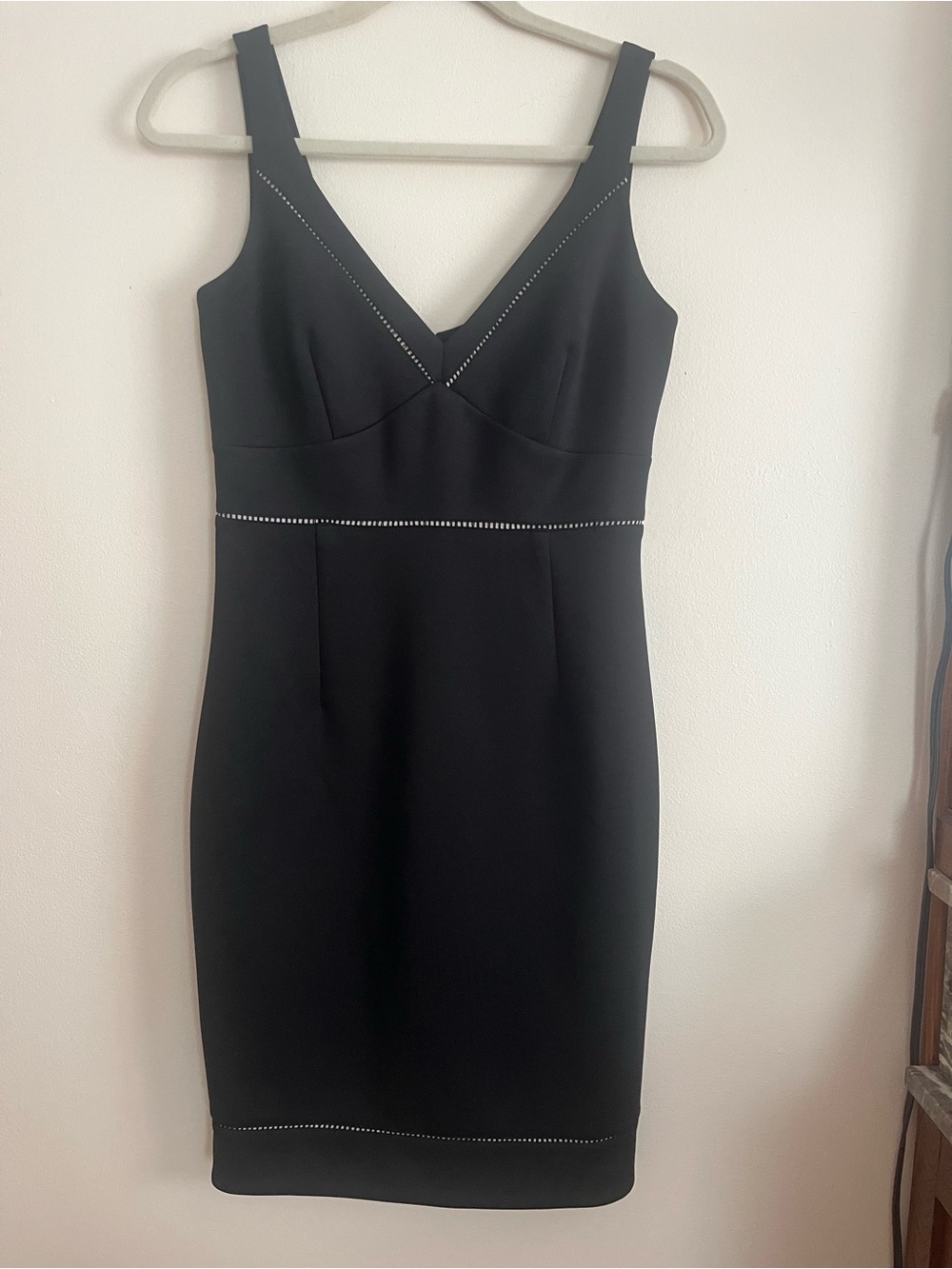 Classic Black Sleeveless V-Neck Sheath Dress clean lines. Beautiful